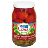 A jar of My Family (Moja Semja) - Tomato & Cucumber - 860g, with a Russian label, displays vibrant red tomatoes and green cucumbers. This snack is delicious and nutrient-rich, making it perfect for any occasion.